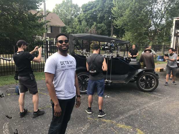 Behind the scenes: the model t comes down the street.