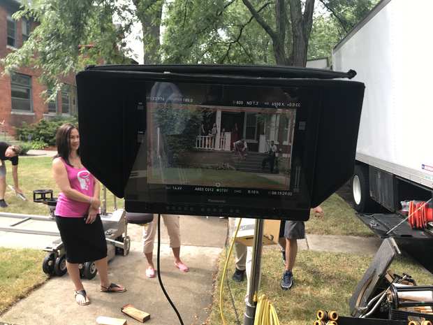Behind the scenes: watching a take in the street.