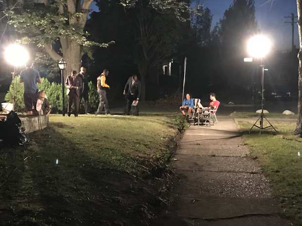 Behind the scenes: night exterior: lights on the lawn.