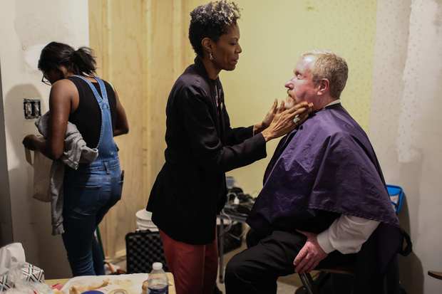 Behind the scenes: makeup before a scene.