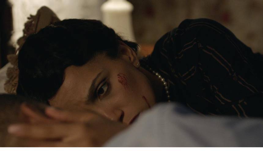 Film frame: Gladys after the glass, cut above the eye.