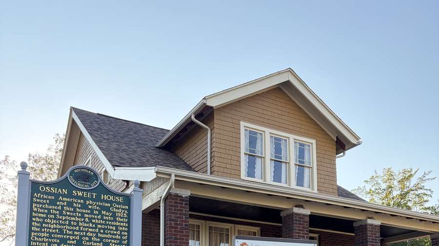 The restored Sweet house at 2905 Garland with its historical marker.