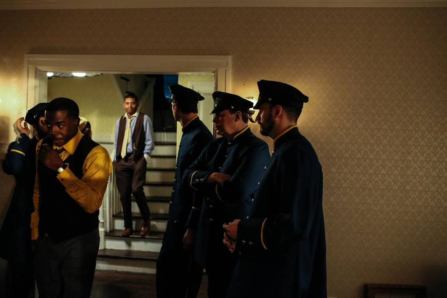 Detroit police officers filling the Sweets' hallway.